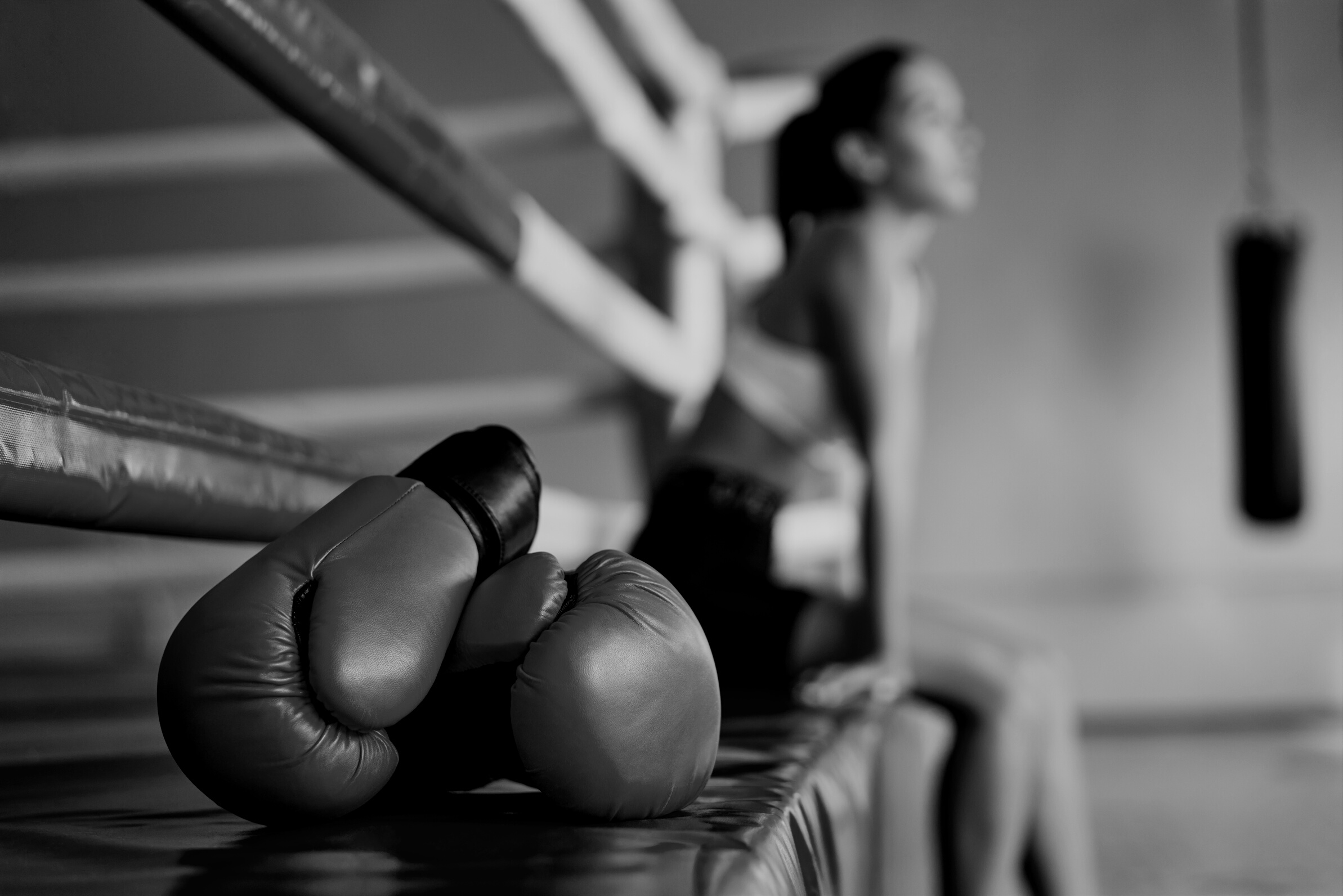 Red Boxing Gloves on Boxing Ring in Gym